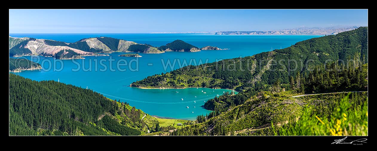 Image of Port Underwood. Oyster Bay and Willawa Point centre, with Horohora Kakayu Island and Robertson Point behind. White Bluffs, Cloudy Bay and Cape Campbell distant. Panorama, Port Underwood, Marlborough District, Marlborough Region, New Zealand (NZ) stock photo image