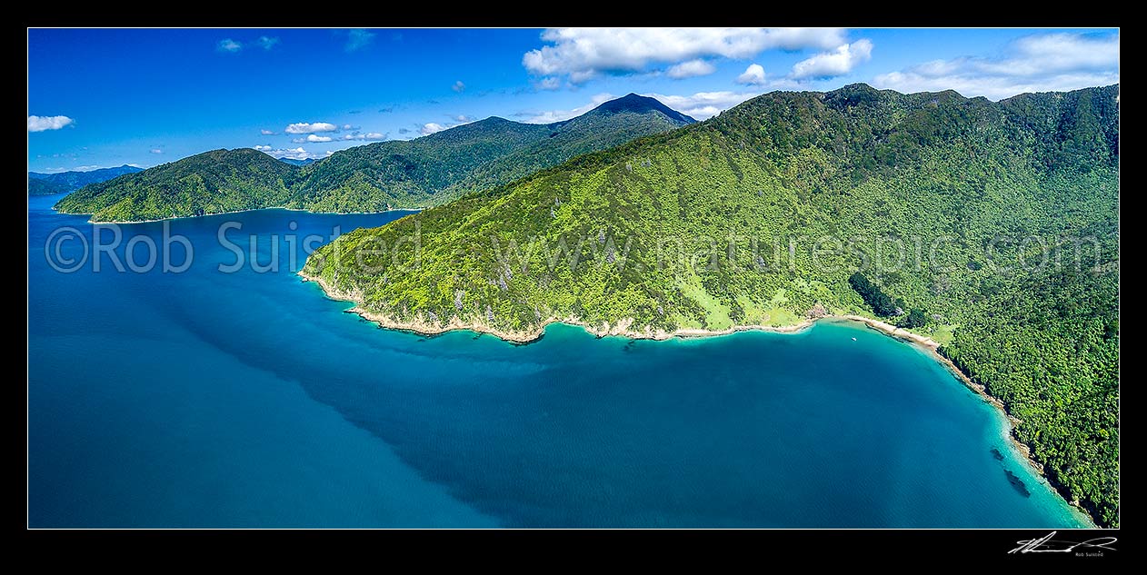 Image of Cannibal Cove (right), Te Ahitaore point centre, and Ship Cove (Meretoto) left. Mt Furneaux high above. Outer Queen Charlotte Sound (Totaranui). Aerial panorama, Marlborough Sounds, Marlborough District, Marlborough Region, New Zealand (NZ) stock photo image