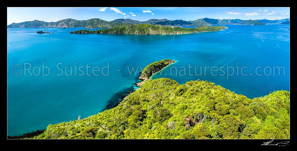 Image of Motuara Island Scenic and Historic Reserve, and Hippa Island. Outer Queen Charlotte Sound. Looking over Cook's Lookout towards Long Island (left) and Arapaoa (Arapawa) Island beyond. Aerial panorama, Marlborough Sounds, Marlborough District, Marlborough Region, New Zealand (NZ) stock photo image