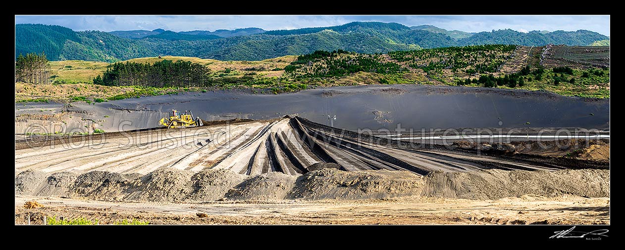 Image of Taharoa Ironsands mining operation owned by NZ Steel. Bulldozer pushing iron rich sand. Panorama, Taharoa, Waitomo District, Waikato Region, New Zealand (NZ) stock photo image