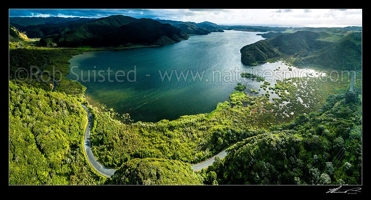 Image of Lake Taharoa with Taharoa Road winding past. Aerial panorama, Taharoa, Waitomo District, Waikato Region, New Zealand (NZ) stock photo image