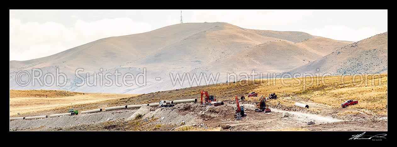 Image of Mackenzie Basin irrigation scheme under construction at Simons Pass to irrigate the dry alpine basin. These controversial programmes are changing a unique landscape. Panorama, Tekapo, MacKenzie District, Canterbury Region, New Zealand (NZ) stock photo image