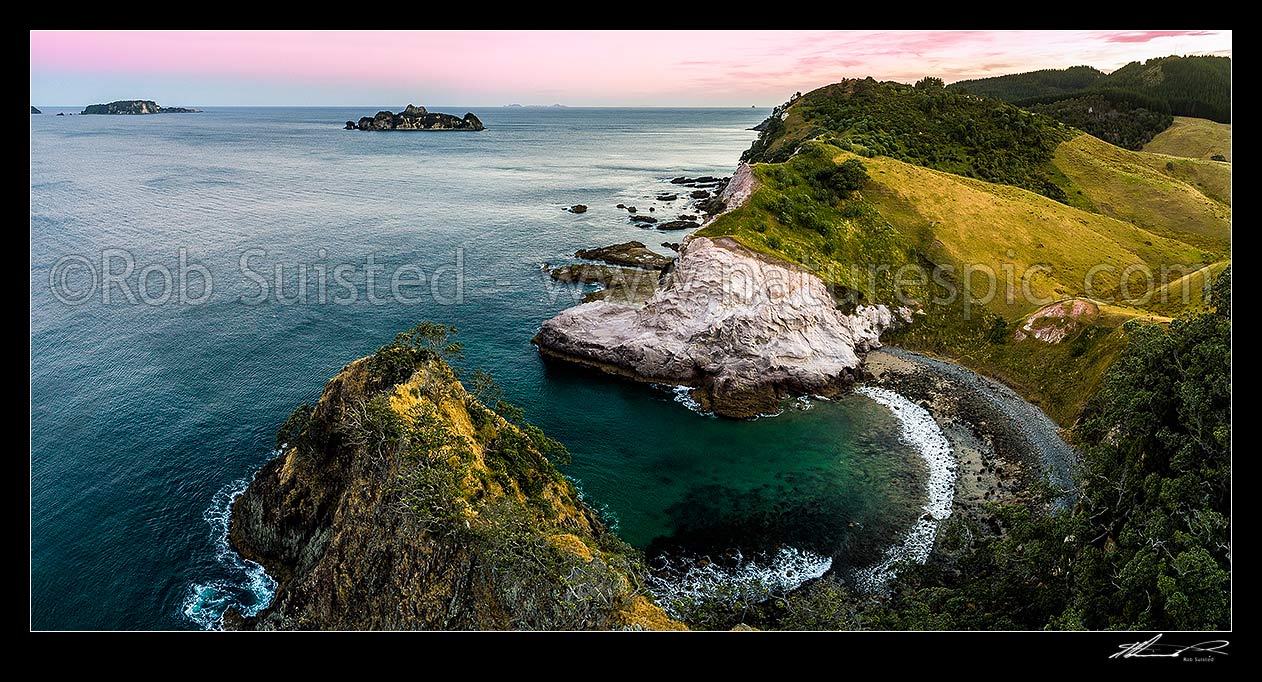 Image of Opito Point Historic Reserve coast and coves looking south east past Motukoruenga Island to distant The Alderman Islands. Aerial panorma at dusk, Opito Bay, Coromandel Peninsula, Thames-Coromandel District, Waikato Region, New Zealand (NZ) stock photo image