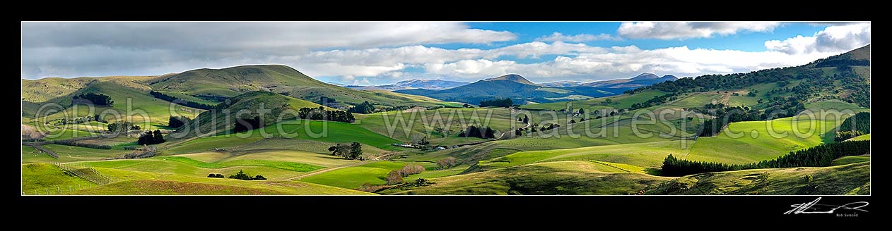 Image of North Otago farmland panorama over lush hills. North Otago farmland at Goodwood, Palmerston, Waitaki District, Canterbury Region, New Zealand (NZ) stock photo image