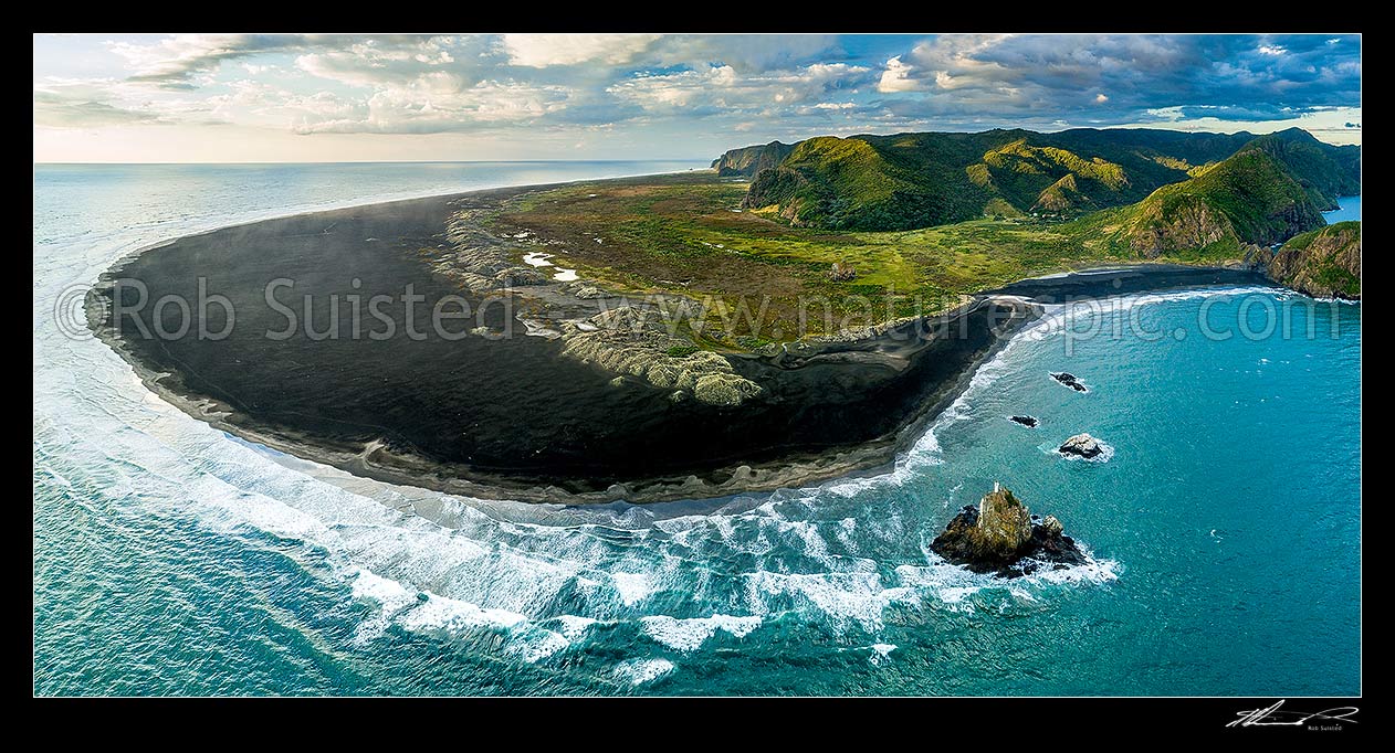 Image of Whatipu Beach and Manukau Harbour entrance (right), looking north past Ninepin Rock lighthouse and black ironsand. Waitakere Ranges right. Aerial view, Whatipu Beach, Waitakere City District, Auckland Region, New Zealand (NZ) stock photo image