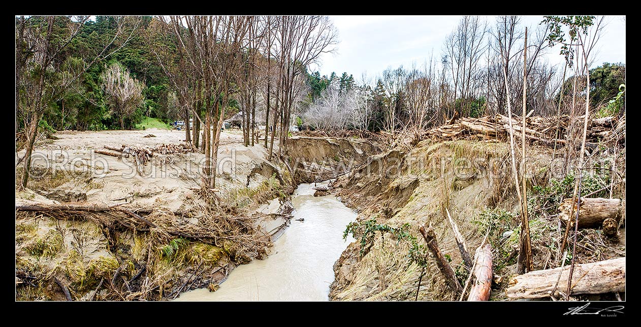 Image of Tolaga Bay floods in June 2018 brought large amounts of forestry timber slash and sediment down Mangatokerau River. Note forestry high above water level. Panorama, Tolaga Bay, Gisborne District, Gisborne Region, New Zealand (NZ) stock photo image