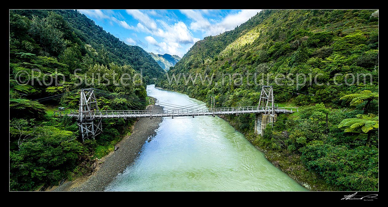 Image of Tauranga Bridge, historic harp suspension bridge of 57.8 metres built in 1922 over the Waioeka River. A signifcant engineering design for it's day to meet local constraints, Waioeka Gorge, Opotiki District, Bay of Plenty Region, New Zealand (NZ) stock photo image