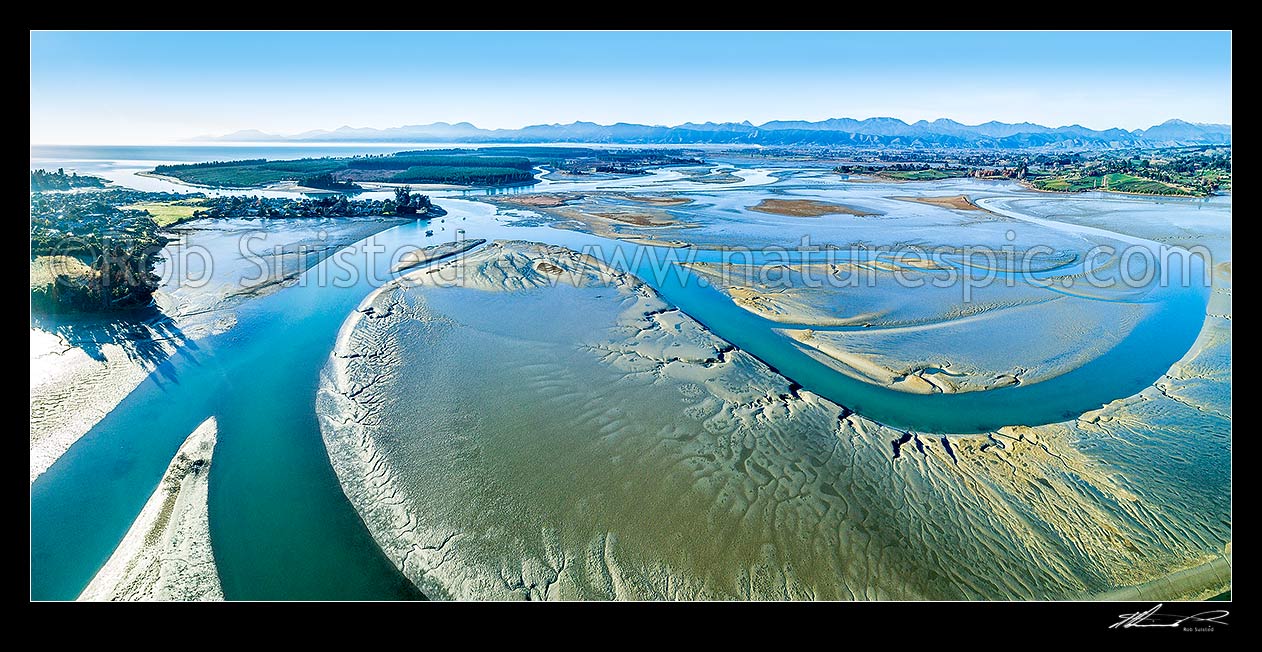 Image of Waimea Inlet estuary, with Mapua (left), Grossi Point, Rabbit Island Rough Island and Nelson beyond. Aerial panorama over sand and mudflats at low tide, Mapua, Tasman District, Tasman Region, New Zealand (NZ) stock photo image