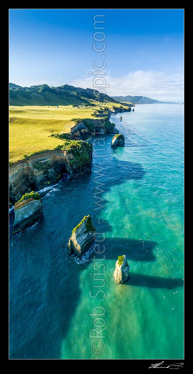 Image of Tongaporutu Coast and rock stacks and birds. Three sisters rocks. Aerial view looking south past White Cliffs to Pariokariwa Point. North Taranaki. Vertical panorama, Tongaporutu, New Plymouth District, Taranaki Region, New Zealand (NZ) stock photo image