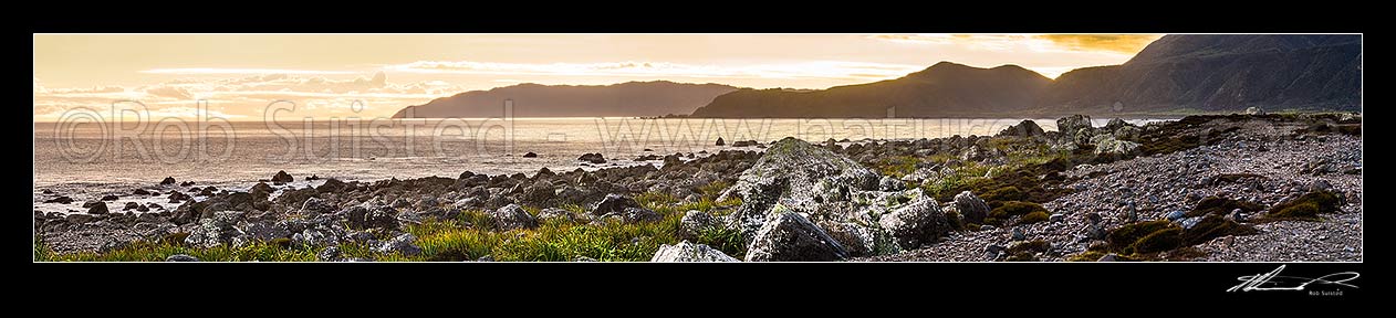 Image of Turakirae Head Scientific Reserve, looking out at evening across towards Cook Strait (left), Sinclair Head, and Baring Head (centre right). Panorama, Turakirae Head, Hutt City District, Wellington Region, New Zealand (NZ) stock photo image