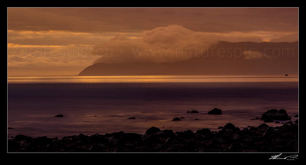 Image of Wellington South Coast and Sincalir Head (left) on a moody twilight, see from Turakirae Head Scientific Reserve. Panorama, Turakirae Head, Hutt City District, Wellington Region, New Zealand (NZ) stock photo image