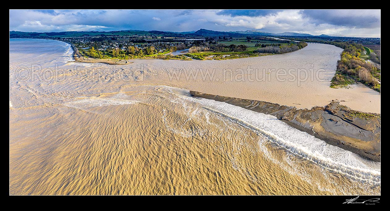 Image of Tukituki River mouth and estuary, in flood after heavy rain. Town of Haumoana at left, with Te Mata Peak beyond. Aerial panorama, Clive, Hastings District, Hawke's Bay Region, New Zealand (NZ) stock photo image