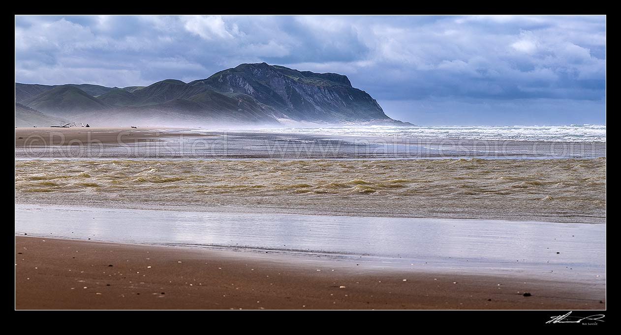 Image of Cape Turnagain, prominent headland off central Hawke's Bay, seen from Herbertville coast. Named by Captain James Cook in 1769 as the point he turned to head north. Panorama, Herbertville, Tararua District, Manawatu-Wanganui Region, New Zealand (NZ) stock photo image