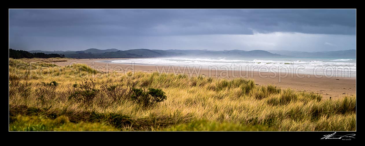 Image of Porangahau Beach on a moody day, looking north towards Blackhead Point. Panorama, Porangahau, Hawke's Bay Region, New Zealand (NZ) stock photo image