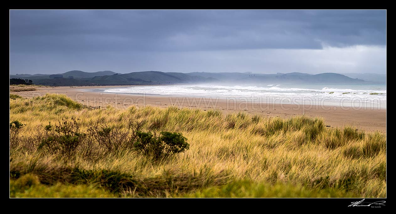 Image of Porangahau Beach on a moody day, looking north towards Blackhead Point. Panorama, Porangahau, Hawke's Bay Region, New Zealand (NZ) stock photo image