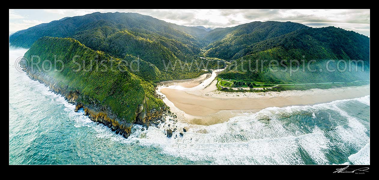 Image of Kohaihai River Valley and Heaphy Track Great Walk carpark and camping ground. Kohaihai Bluff at left. Aerial panorama on a misty morning, Kahurangi National Park, Buller District, West Coast Region, New Zealand (NZ) stock photo image