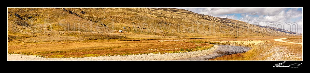 Image of Nevis River Valley, remote backcountry valley with Nevis road between Bannockburn and Garston. Old musterers hut visible. Garvie Mountains behind. Panorama, Nevis, Central Otago District, Otago Region, New Zealand (NZ) stock photo image