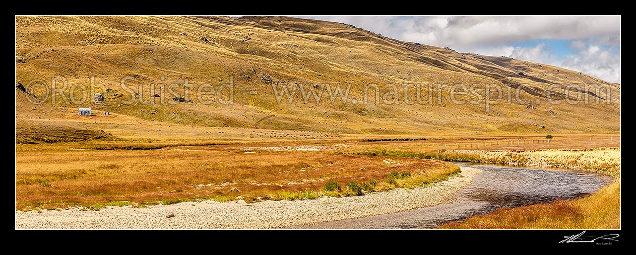 Image of Nevis River Valley, remote backcountry valley with Nevis road between Bannockburn and Garston. Old musterers hut visible. Garvie Mountains behind. Panorama, Nevis, Central Otago District, Otago Region, New Zealand (NZ) stock photo image