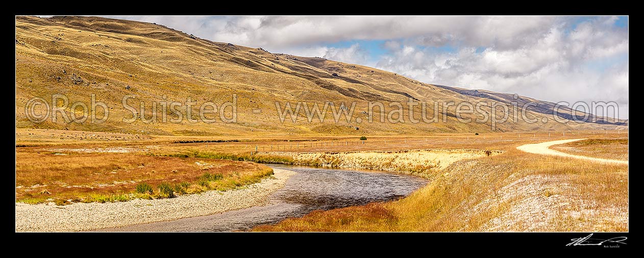 Image of Nevis River Valley, remote backcountry valley with Nevis road between Bannockburn and Garston. Garvie Mountains behind, Nevis, Central Otago District, Otago Region, New Zealand (NZ) stock photo image