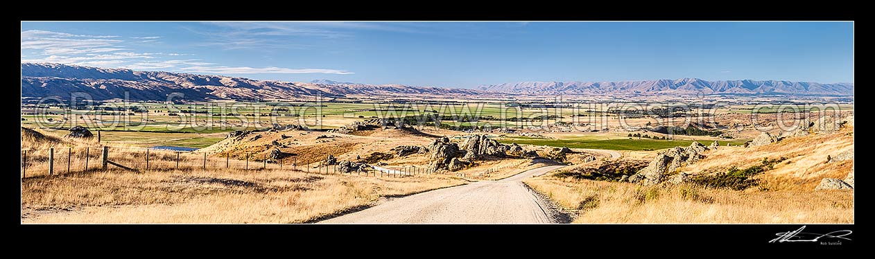 Image of Upper Taieri Plain seen from near Paerau. Panorama over irrigated plains of the Upper Taieri towards the Hawkdun and Ida Ranges. Summer, Patearoa, Central Otago District, Otago Region, New Zealand (NZ) stock photo image