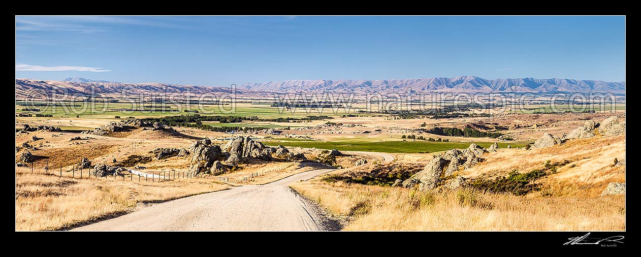 Image of Upper Taieri Plain seen from near Paerau. Panorama over irrigated plains of the Upper Taieri towards the Hawkdun and Ida Ranges. Maniototo, Patearoa, Central Otago District, Otago Region, New Zealand (NZ) stock photo image