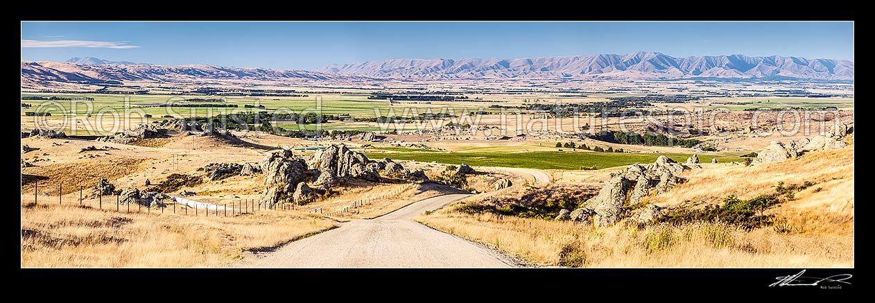 Image of Upper Taieri Plain seen from near Paerau. Panorama over irrigated plains of the Upper Taieri towards the Hawkdun and Ida Ranges, and Rough Ridge (left). Maniototo, Patearoa, Central Otago District, Otago Region, New Zealand (NZ) stock photo image