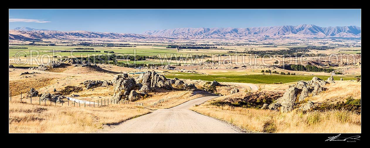 Image of Upper Taieri Plain seen from near Paerau. Panorama over irrigated plains of the Upper Taieri towards the Hawkdun and Ida Ranges, and Rough Ridge (left). Maniototo, Patearoa, Central Otago District, Otago Region, New Zealand (NZ) stock photo image