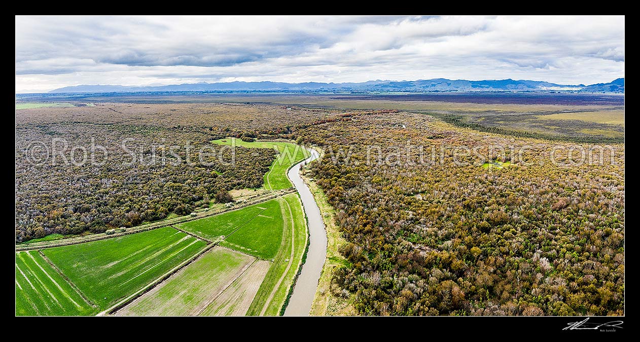 Image of Piako River in the Flax Block Wildlife Management Reserve and Kopuatai Wetland Management Reserve at Maukoro Landing. Aerial view over Kopuatai Peat Dome and Hauraki Plains, Patetonga, Hauraki District, Waikato Region, New Zealand (NZ) stock photo image