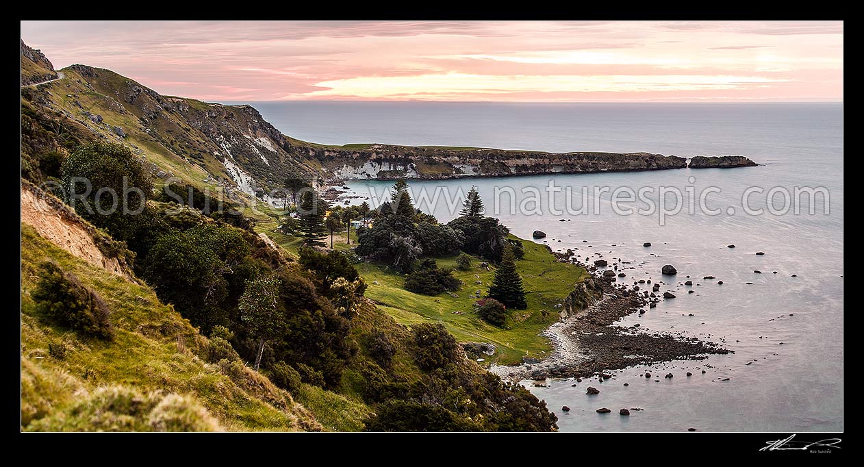 Image of Kinikini Point, with Taramahiti Point (Long Point) behind, on Mahia Peninsula, at dusk. Kinikini Station. Looking south into Hawke Bay. Panorama, Mahia, Wairoa District, Hawke's Bay Region, New Zealand (NZ) stock photo image