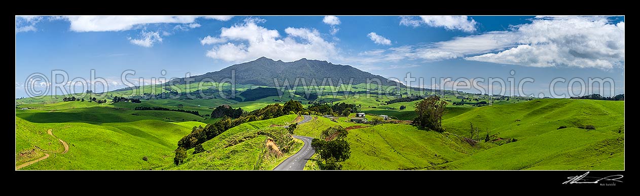 Image of Mount Karioi (756m) high above coastal Waikato farmland. Panorama over lush rural land, Raglan, Waikato District, Waikato Region, New Zealand (NZ) stock photo image