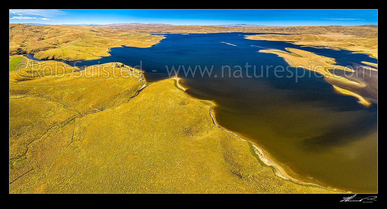 Image of Lake Onslow 700m in Lammermoor Ranges. Formed in 1890 by damming of Teviot River and Dismal Swamp. Aerial panorama with Teviot River outlet and cribs at left, Roxburgh, Central Otago District, Otago Region, New Zealand (NZ) stock photo image