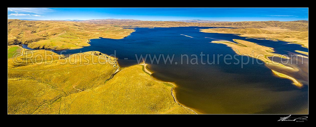 Image of Lake Onslow 700m in Lammermoor Ranges. Formed in 1890 by damming of Teviot River and Dismal Swamp. Aerial panorama with Teviot River outlet and cribs at left, Roxburgh, Central Otago District, Otago Region, New Zealand (NZ) stock photo image