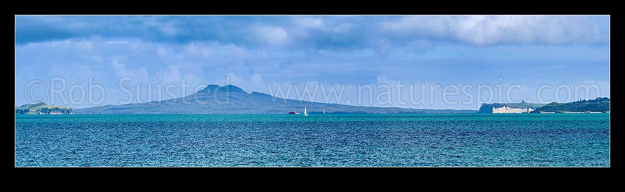 Image of Rangitoto Island seen across Tamaki Strait from Beachlands. Panorama with sailboat and ferry, Beachlands, Auckland Region, New Zealand (NZ) stock photo image