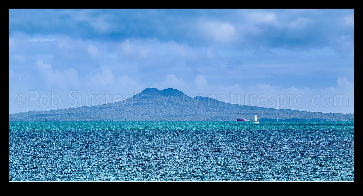 Image of Rangitoto Island seen across Tamaki Strait from Beachlands. Panorama with sailboat and ferry, Beachlands, Auckland Region, New Zealand (NZ) stock photo image