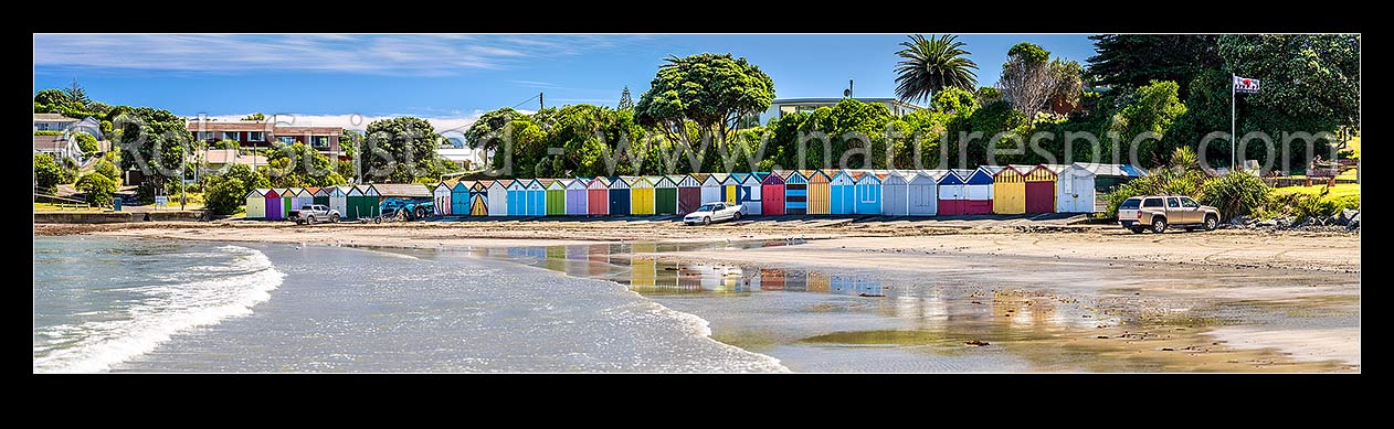 Image of Titahi Bay boatsheds, iconic brightly painted sheds on beach front at north end. Panorama, Titahi Bay, Porirua City District, Wellington Region, New Zealand (NZ) stock photo image