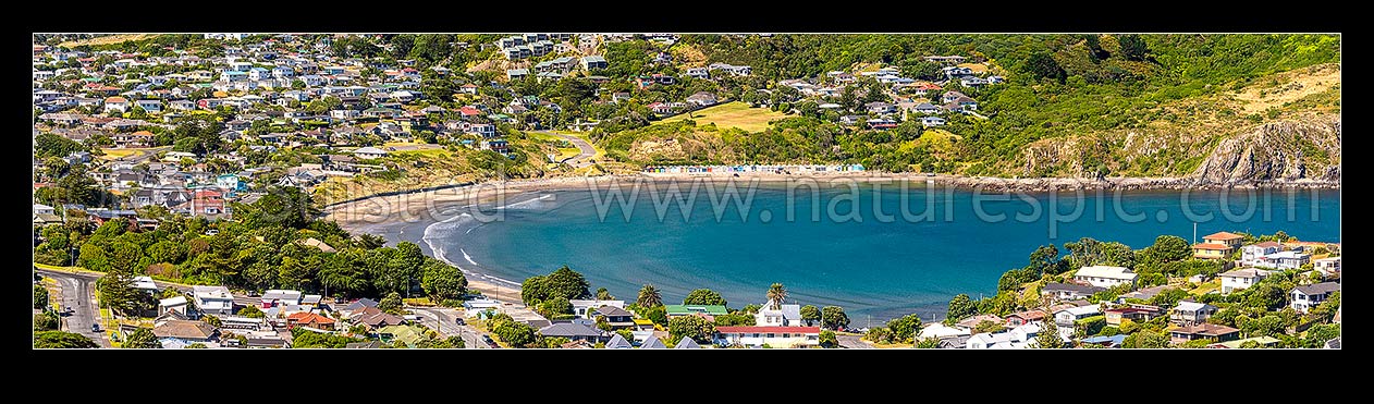 Image of Titahi Bay and Beach, with iconic boatsheds and homes visible. Panorama, Titahi Bay, Porirua City District, Wellington Region, New Zealand (NZ) stock photo image