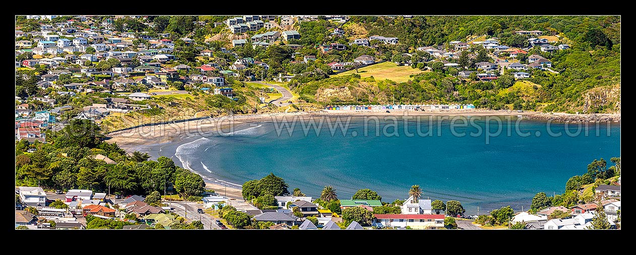 Image of Titahi Bay and Beach, with iconic boatsheds and homes visible. Panorama, Titahi Bay, Porirua City District, Wellington Region, New Zealand (NZ) stock photo image