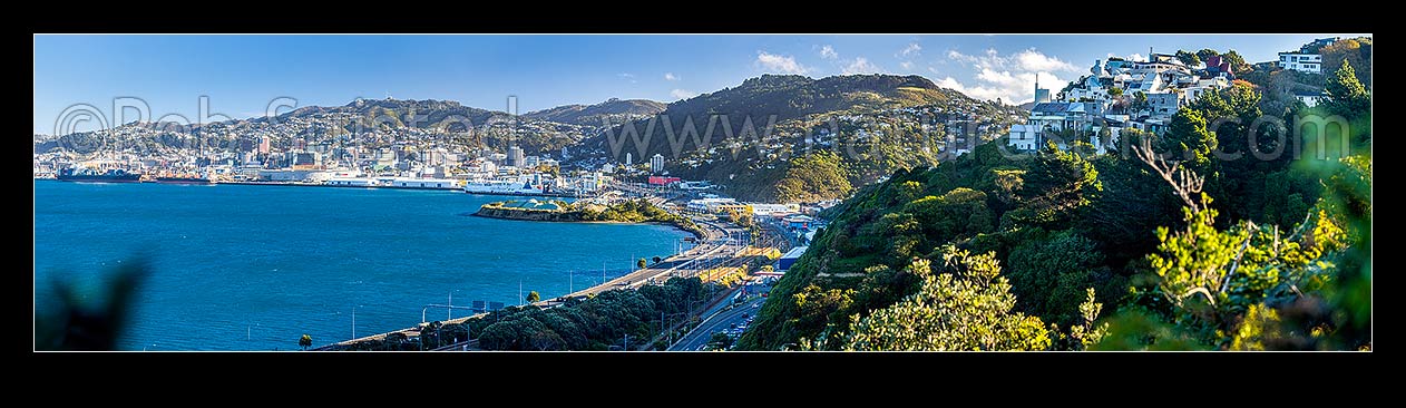 Image of Wellington City, with SH1 motorway passing thru Kaiwharawhara and Thorndon. Wadestown suburb centre right. Sir Ian Athfield house far right. Panorama, Kaiwharawhara, Wellington City District, Wellington Region, New Zealand (NZ) stock photo image