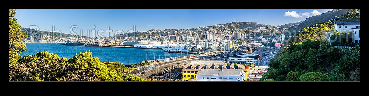 Image of Wellington gateway through Kaiwharawhara and Thorndon. Wellington Motorway and rail corridor entering Wellington City from the north, Port at left. Panorama, Kaiwharawhara, Wellington City District, Wellington Region, New Zealand (NZ) stock photo image