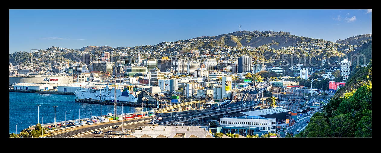 Image of Wellington City seen from Kaiwharawhara, looking over motorway and interislander ferry terminal towards CBD. Thorndon right. Panorama, Kaiwharawhara, Wellington City District, Wellington Region, New Zealand (NZ) stock photo image