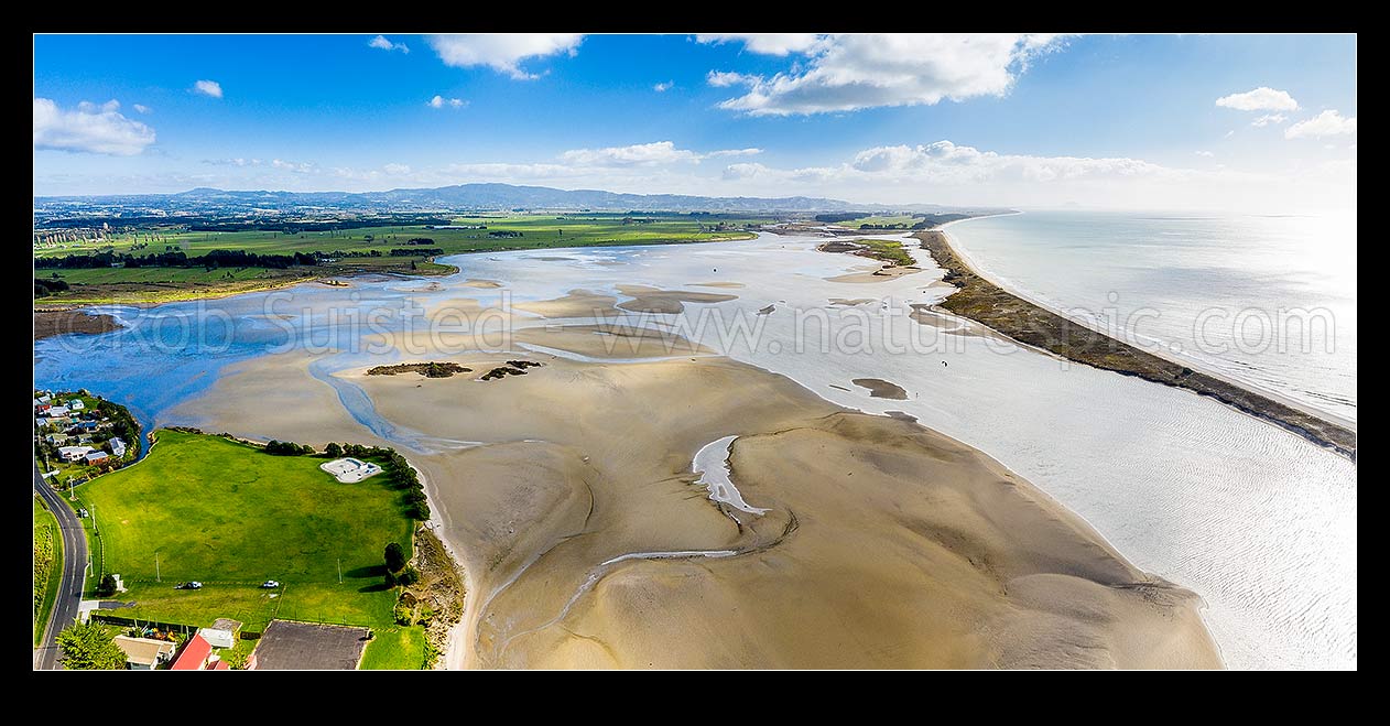 Image of Maketu harbour estuary with Kaituna River and river mouth (centre right) looking west from Maketu township. Aerial panorama, Maketu, Western Bay of Plenty District, Bay of Plenty Region, New Zealand (NZ) stock photo image