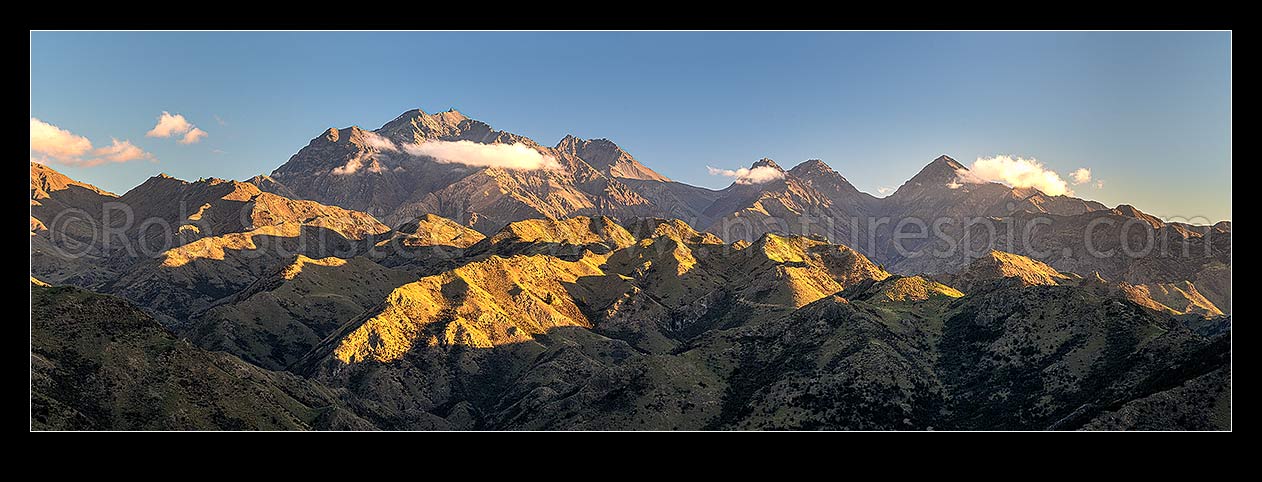 Image of Mt Tapuae-o-Uenuku (2885m) seen from the Cam River. Mt Alarm (2877m), Muzzle Pass, Mitre Peak (2621m), Trail Saddle, Mt Gladstone (in cloud) right. Panorama, Awatere Valley, Marlborough District, Marlborough Region, New Zealand (NZ) stock photo image