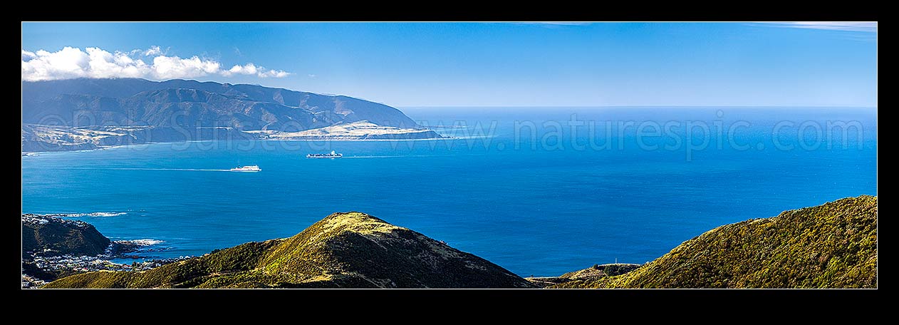 Image of Wellington South Coast and Harbour entrance seen from Te Kopahau Reserve. Pencarrow, Baring and Turakirae Heads behind. Island Bay left. Panorama, Owhiro Bay, Wellington City District, Wellington Region, New Zealand (NZ) stock photo image