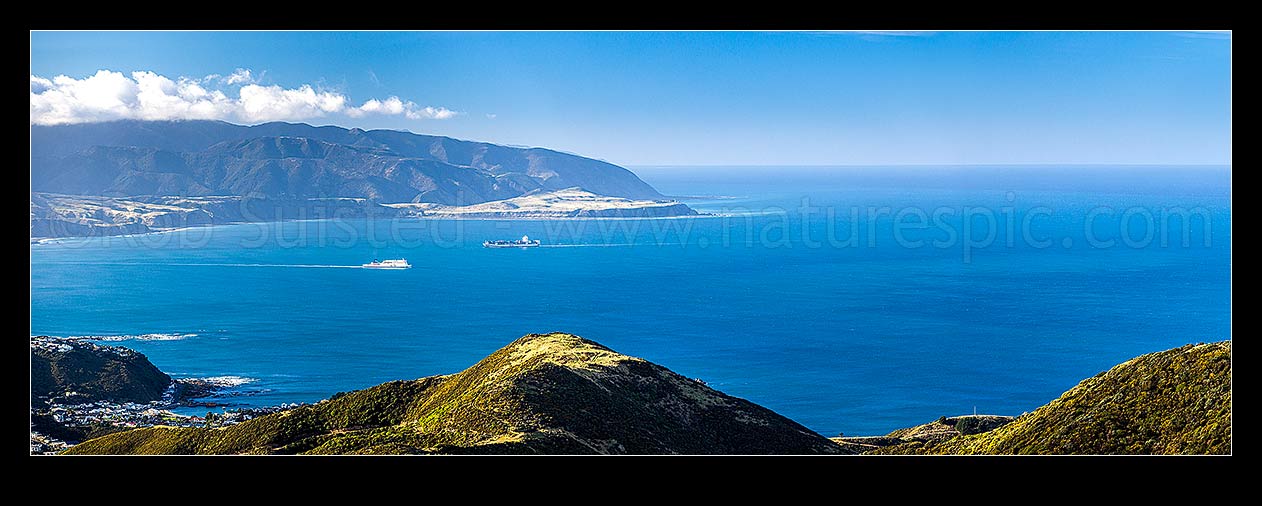 Image of Wellington South Coast and Harbour entrance seen from Te Kopahau Reserve. Pencarrow, Baring and Turakirae Heads behind. Island Bay left. Panorama, Owhiro Bay, Wellington City District, Wellington Region, New Zealand (NZ) stock photo image