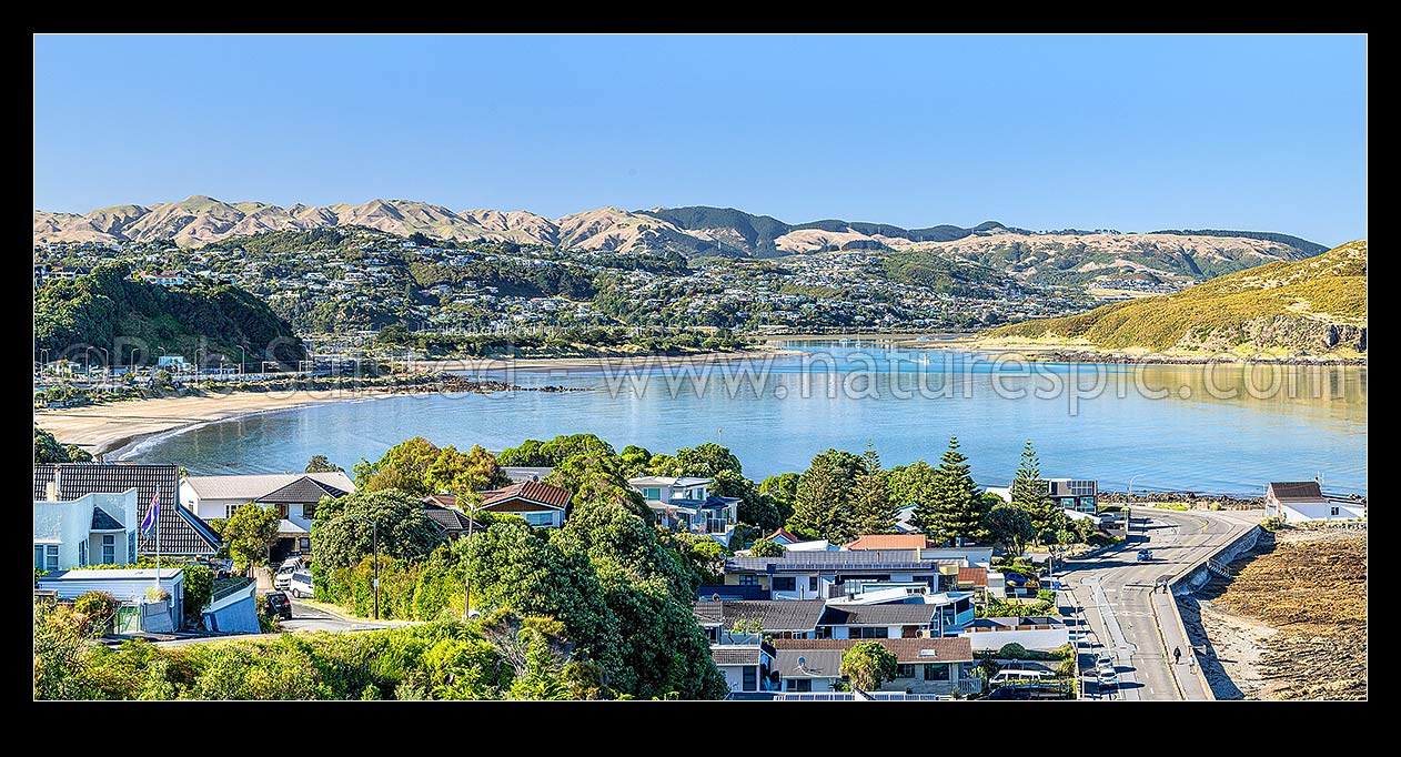 Image of Plimmerton suburb and beach, looking south to Mana, Paremata and Papakowhai suburbs and Porirua Harbour. Belmont Regional Park above. Panorama, Plimmerton, Porirua City District, Wellington Region, New Zealand (NZ) stock photo image