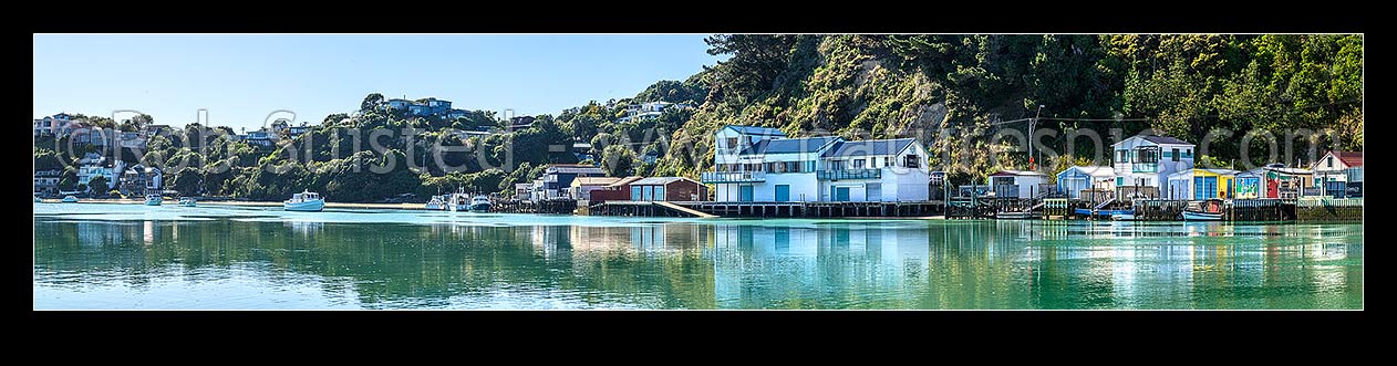 Image of Paremata boatsheds and boating club reflected at Ivey Bay on the Pauatahanui Inlet arm of Porirua Harbour. Panorama, Paremata, Porirua City District, Wellington Region, New Zealand (NZ) stock photo image