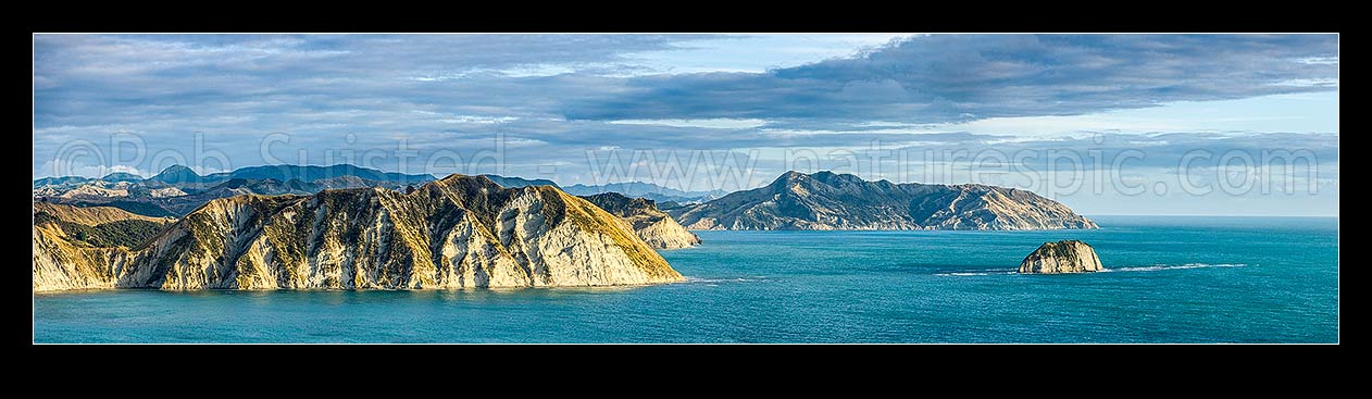 Image of Tolaga Bay northern cliffs and Te Karaka Point (centre), looking north past Paerau Point to Marau Peak (277m) and Marau Point right. Panorama, Tolaga Bay, Gisborne District, Gisborne Region, New Zealand (NZ) stock photo image