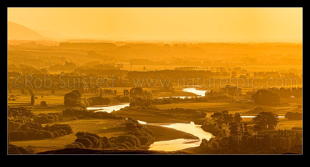 Image of Manawatu River winding through rural farmland near Palmerston North. Evening panorama, Ashhurst, Palmerston North City District, Manawatu-Wanganui Region, New Zealand (NZ) stock photo image