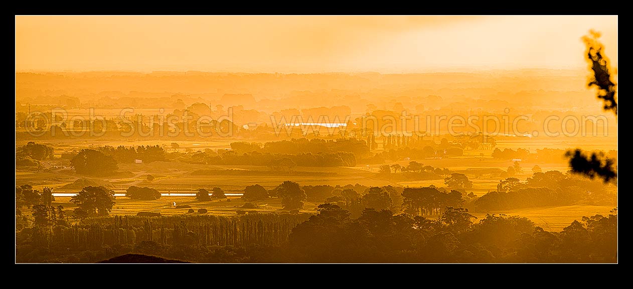 Image of Manawatu sunset over farmland near Palmerston North, looking east. Panorama, Ashhurst, Palmerston North City District, Manawatu-Wanganui Region, New Zealand (NZ) stock photo image