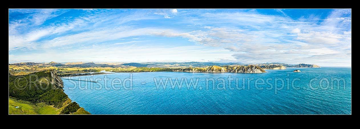 Image of Tolaga Bay aerial panorama. Uawa River and township at left, Te Karaka and Marau points far right, Tolaga Bay, Gisborne District, Gisborne Region, New Zealand (NZ) stock photo image